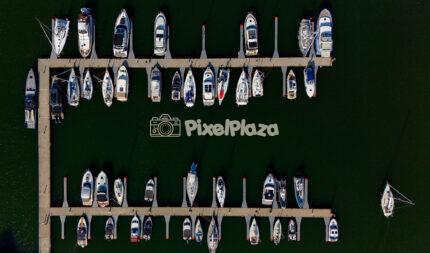 Drone View of Yacht Marina with Sailboats - Scenic Aerial Harbor Perspective